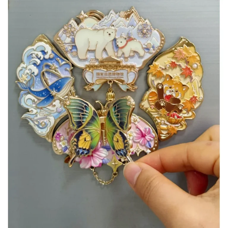 Metal fridge magnet collection with elephants and colorful animal designs