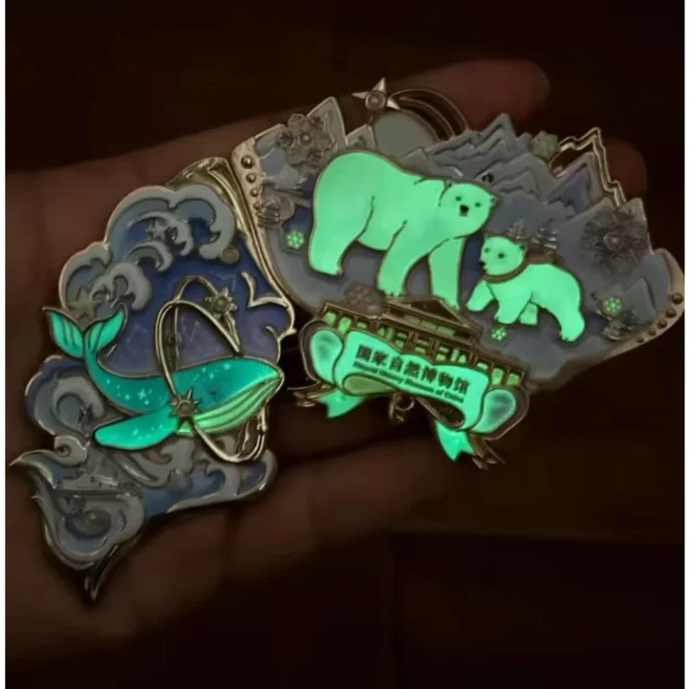 Glow-in-the-dark elephant metal fridge magnet with butterfly details