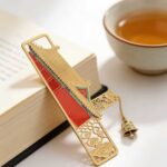 Personalised metal bookmark in brass or stainless steel with engraved design - custom ForgeCrafts product manufactured for libraries, schools, promotional gifts, graduation gifts, and wedding favors