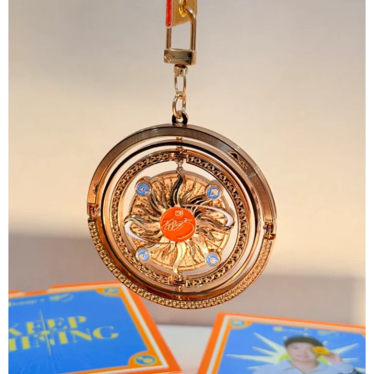 Round decorative medal with an ornate relief design and ribbon attachment.