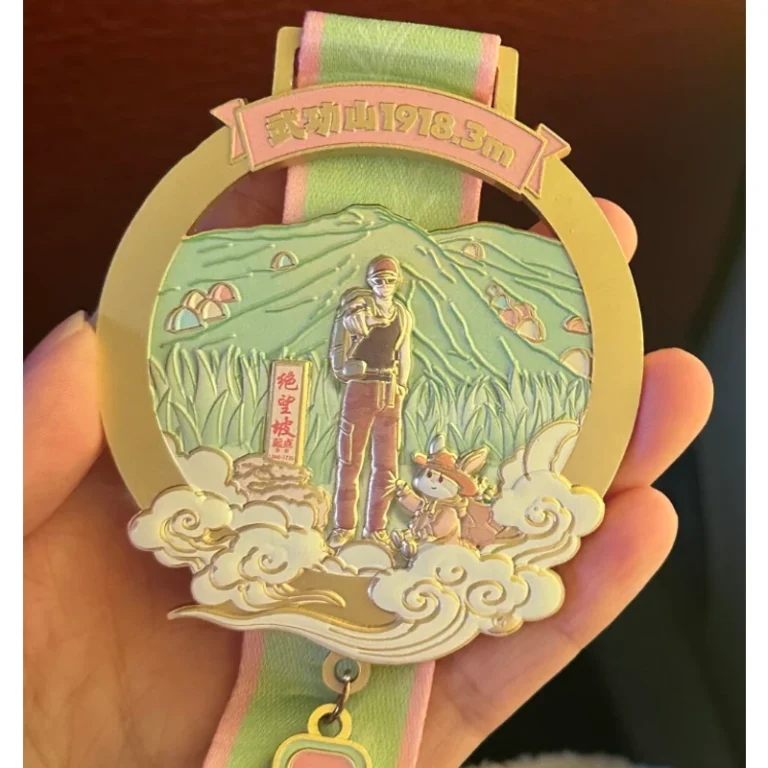 Gold-tone and green custom medal with a tree relief and matching ribbon.