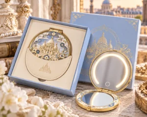 Blue and gold-tone Paris enamel compact mirror shown open with a matching presentation gift set.