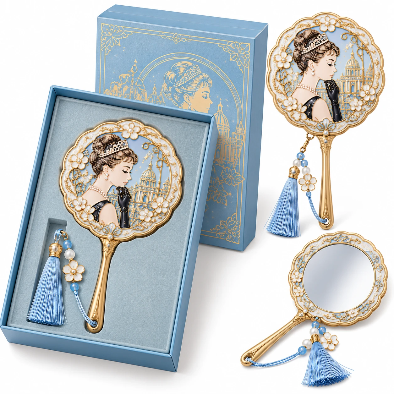Blue and gold-tone portrait handheld mirror with tassel, shown with its presentation gift box.